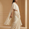 A-line top with flowing wide-leg palazzo pants and a draped cape. Suit - Classic Off White
