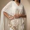 A-line top with flowing wide-leg palazzo pants and a draped cape. Suit - Classic Off White